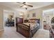 Comfortable carpeted bedroom featuring a wooden bed frame and access to a separate office space at 4006 Sincerity Rd, Monroe, NC 28110