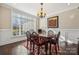 Bright dining room features hardwood floors, a chandelier, and large windows at 4006 Sincerity Rd, Monroe, NC 28110