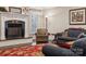 Living room fireplace with a dark granite hearth at 4006 Sincerity Rd, Monroe, NC 28110