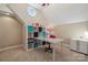 Home office with built-in shelving, a glass desk, and a window at 4006 Sincerity Rd, Monroe, NC 28110