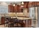 Kitchen with granite countertops and dark wood cabinets at 4006 Sincerity Rd, Monroe, NC 28110