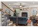 Living room with fireplace, hardwood floors, and a staircase at 4006 Sincerity Rd, Monroe, NC 28110