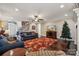 Spacious living room featuring fireplace, hardwood floors, and staircase at 4006 Sincerity Rd, Monroe, NC 28110