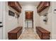 Mud room with tile floors, storage benches and upper cabinets at 4006 Sincerity Rd, Monroe, NC 28110