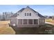 A rear exterior view shows a screened-in porch on a well-maintained home with nice brick accents at 4006 Sincerity Rd, Monroe, NC 28110