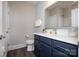 Well-lit bathroom with navy vanity, modern fixtures, and a clean design, providing a functional and attractive space at 405 Newstyle Way # 1, Cramerton, NC 28056