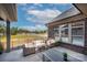 Stylish covered patio with outdoor seating overlooking a serene neighborhood at 405 Newstyle Way # 1, Cramerton, NC 28056