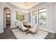 Bright dining room with a large window, stylish rug, and modern chandelier at 405 Newstyle Way # 1, Cramerton, NC 28056