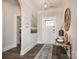 Inviting foyer with dark wood floors, white trim, modern decor, and ample natural light at 405 Newstyle Way # 1, Cramerton, NC 28056