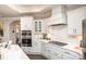 Modern kitchen featuring white cabinets, stainless steel appliances, and an open layout at 405 Newstyle Way # 1, Cramerton, NC 28056