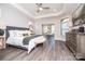 Spacious main bedroom with tray ceiling, ample natural light, and wood-look flooring at 405 Newstyle Way # 1, Cramerton, NC 28056