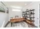 Cozy home office with a rustic desk, decorative shelving, and lots of natural light at 405 Newstyle Way # 1, Cramerton, NC 28056