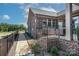 Cozy brick patio features an iron railing, gravel pathway, and outdoor seating area at 405 Newstyle Way # 1, Cramerton, NC 28056