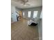 Living room with tile floors and a ceiling fan at 507 Brookwood St, Mooresville, NC 28115