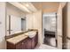 Bathroom with granite countertop and view into bedroom at 525 E 6Th St # 409, Charlotte, NC 28202