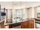 Modern kitchen island with granite countertop and stainless steel dishwasher at 525 E 6Th St # 409, Charlotte, NC 28202