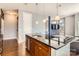 Kitchen island with granite countertop and modern cabinetry at 525 E 6Th St # 409, Charlotte, NC 28202