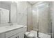 Bathroom featuring tiled shower with glass door and a white vanity at 5404 Verona Rd # 36, Charlotte, NC 28213