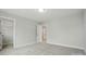 Spacious bedroom features neutral carpeting, ample light, and easy access to the ensuite bathroom at 5404 Verona Rd # 36, Charlotte, NC 28213