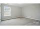 Bright, carpeted bedroom with a window that lets in plenty of natural light at 5404 Verona Rd # 36, Charlotte, NC 28213