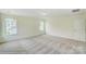 Bright, carpeted bedroom featuring two windows and neutral walls, providing ample natural light at 5404 Verona Rd # 36, Charlotte, NC 28213
