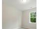Bedroom with a window and neutral color walls at 5404 Verona Rd # 36, Charlotte, NC 28213