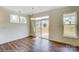 Bright dining area with wood floors, large sliding glass door, and ample natural light at 5404 Verona Rd # 36, Charlotte, NC 28213