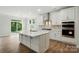 Kitchen with stainless steel appliances, a central island, white cabinets and a view to the back yard at 5404 Verona Rd # 36, Charlotte, NC 28213