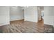 Spacious living room featuring stylish wood floors and neutral paint, perfect for entertaining at 5404 Verona Rd # 36, Charlotte, NC 28213