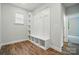 A mud room with built-in storage including a bench, shelving and hooks at 5404 Verona Rd # 36, Charlotte, NC 28213