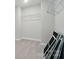 A walk-in closet with shelving and carpeted floors provides generous storage solutions at 5404 Verona Rd # 36, Charlotte, NC 28213