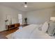 Bright bedroom featuring hardwood floors, a modern ceiling fan and tasteful decor at 5529 Five Knolls Dr, Charlotte, NC 28226