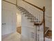 Light-filled foyer showcases a turned staircase with decorative millwork and hardwood treads at 5529 Five Knolls Dr, Charlotte, NC 28226