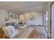 Living room with built-in shelving, hardwood floors, and sliding doors to outdoor at 5529 Five Knolls Dr, Charlotte, NC 28226