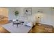 Bright living room with hardwood floors, a modern sofa, and stylish decor at 5529 Five Knolls Dr, Charlotte, NC 28226