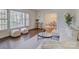 Sunlit living room with hardwood floors and a view of the dining area at 5529 Five Knolls Dr, Charlotte, NC 28226