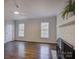 Bright living room features a fireplace and multiple windows for natural light at 5529 Five Knolls Dr, Charlotte, NC 28226