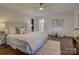 Main bedroom with ensuite bathroom, ceiling fan and hardwood floors at 5529 Five Knolls Dr, Charlotte, NC 28226