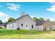 Exterior view of a charming house with light grey siding and a grassy yard at 5633 Torrence St, Charlotte, NC 28269