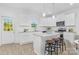 Modern kitchen with white cabinets and an island at 5633 Torrence St, Charlotte, NC 28269