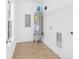 Laundry room with vinyl flooring, water heater, and built-in shelving at 5633 Torrence St, Charlotte, NC 28269