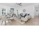 Spacious living room with gray couch and dining table at 5633 Torrence St, Charlotte, NC 28269