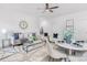 Bright living room with a gray couch and a dining area at 5633 Torrence St, Charlotte, NC 28269