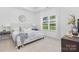 Main bedroom with a plush bed and large window at 5633 Torrence St, Charlotte, NC 28269