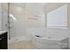 Bathroom with soaking tub and walk-in shower at 6415 Outer Bridge Ln, Charlotte, NC 28270