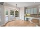 Bright kitchen with granite countertops and light-colored cabinets at 6415 Outer Bridge Ln, Charlotte, NC 28270