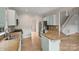 Kitchen with light-blue cabinets, granite countertops and stainless steel appliances at 6415 Outer Bridge Ln, Charlotte, NC 28270