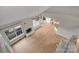 High-angle view of a living room with hardwood floors and kitchen area at 6415 Outer Bridge Ln, Charlotte, NC 28270