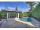 Private backyard oasis with pool and pergola at 6415 Outer Bridge Ln, Charlotte, NC 28270