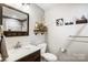 Updated bathroom, featuring a vanity and decorative accents at 703 Southwest Dr, Davidson, NC 28036